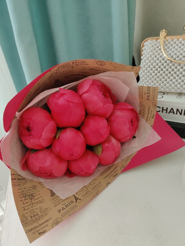 Pink peony bouquet spotted in vintage French wrapping