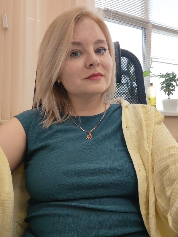 Woman in office attire observed at desk in Izhevsk