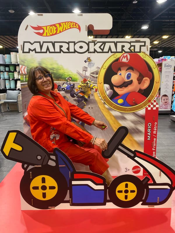 Woman poses with Mario Kart advertisement in Mexico