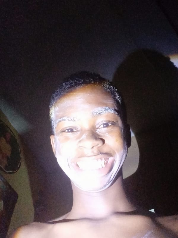 Person documents grooming routine in Nkpor, Nigeria residence