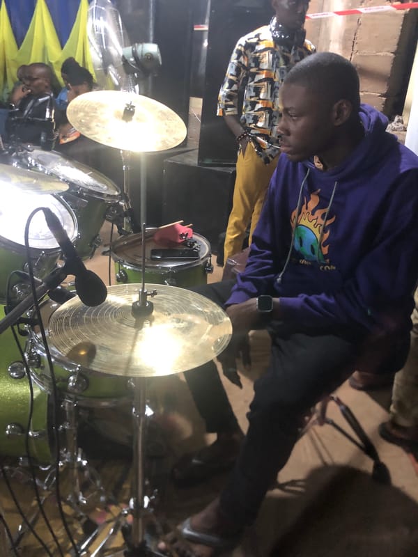Musicians perform drums and keyboard in Obosi, Nigeria