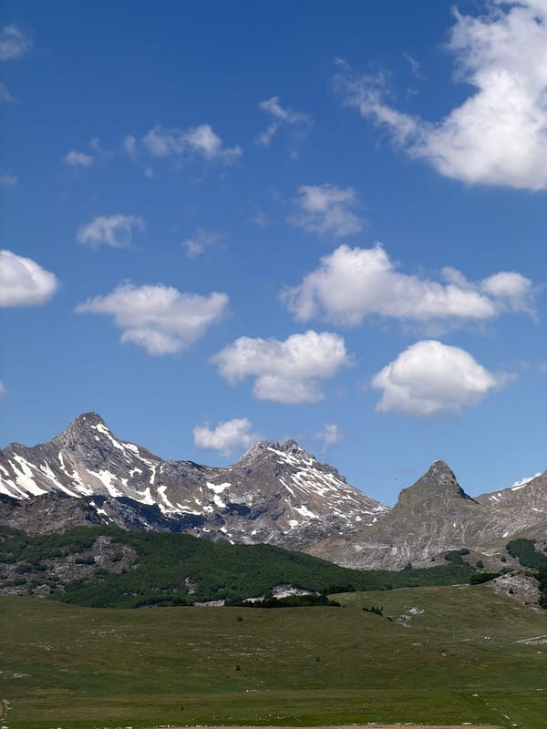 Mountain landscape with snow patches observed in Pašina voda, Montenegro