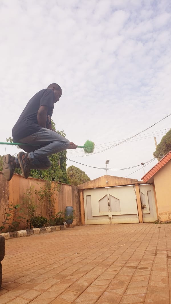 Child plays with exercise equipment outdoors in Narayi, Nigeria