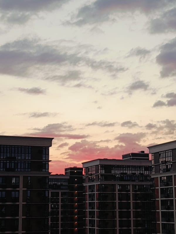 Dusk over a Krasnodar apartment block, quiet evening indoors