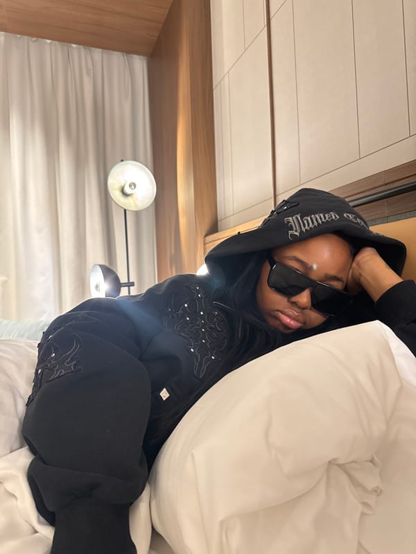 Woman rests in Milan hotel room