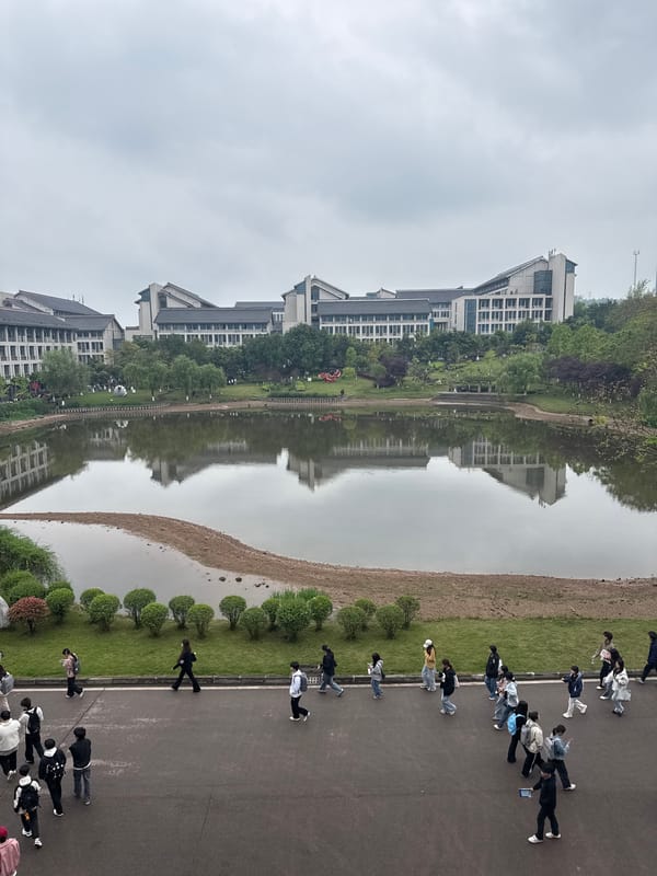People stroll waterfront walkway in Jiangjin China