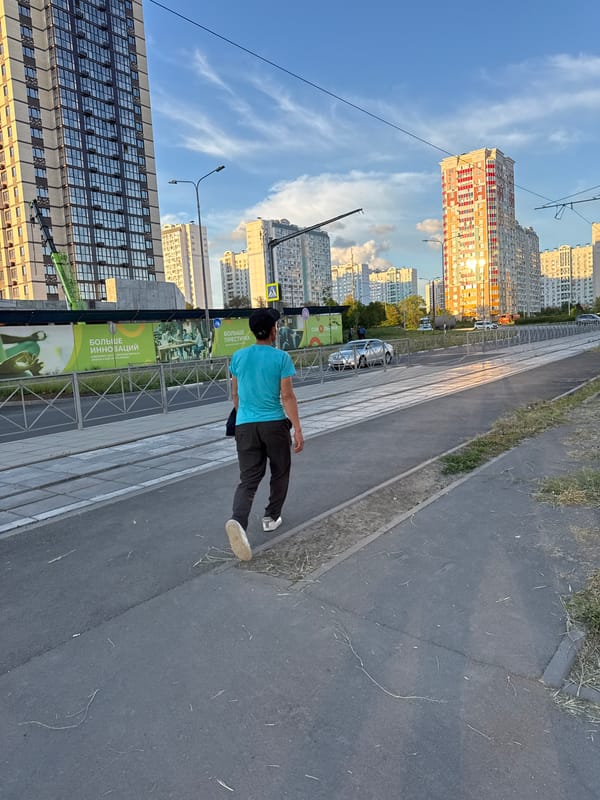 Man walks past construction site in Chaltyr', Russia
