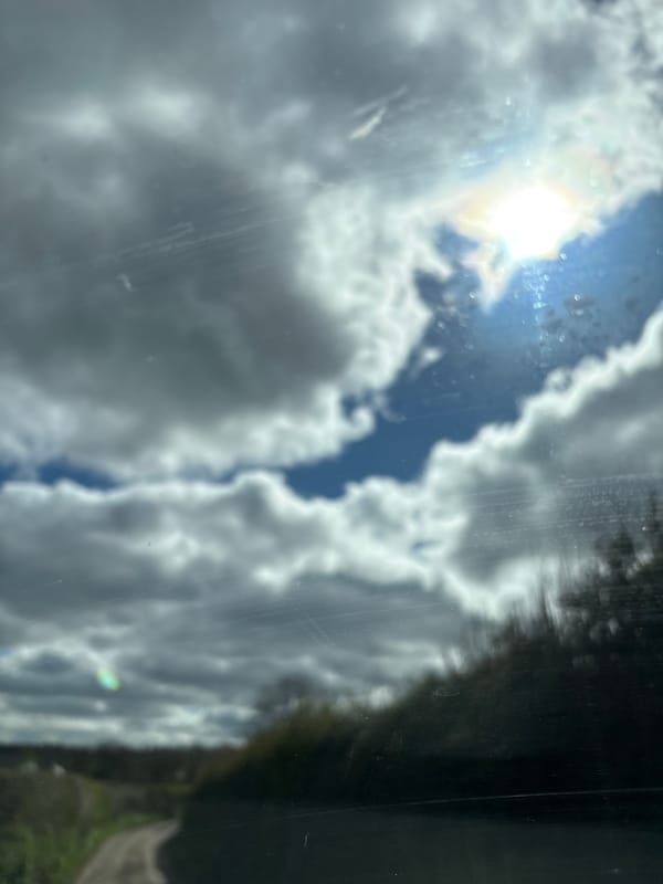 Cloudy skies photographed from vehicles in Pulverbatch countryside