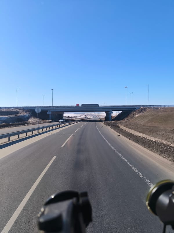 Morning traffic flows on highway near Shali, Russia