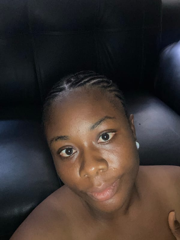 Woman photographed resting on leather couch in Lagos