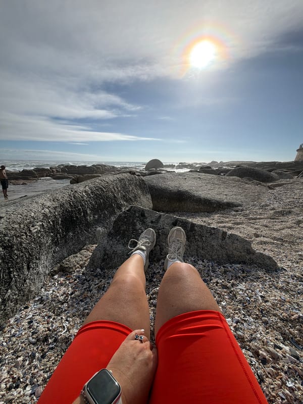 Person spotted on shell-strewn Cape Town beach