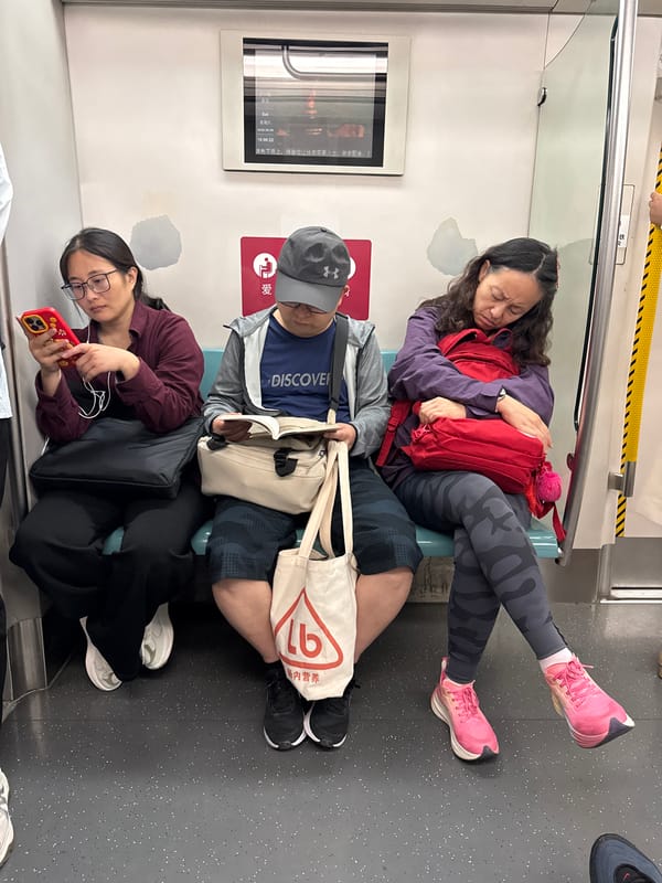 Morning commuters ride subway at Beijing's Xingong station