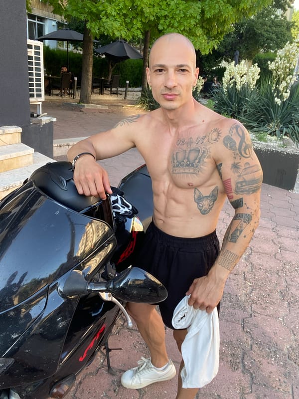 Man poses with motorcycle in Pleven, Bulgaria