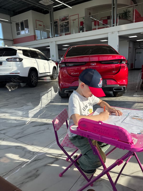 Family visits car dealership in Yaroslavl, Russia
