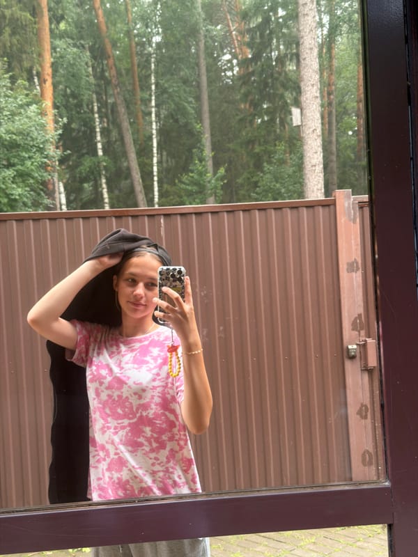 Quiet July morning in Chaikovsky — cat, greenery, and a selfie