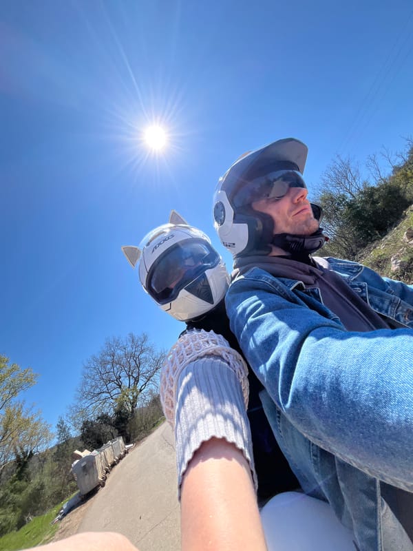 Motorcyclists with cat-ear helmet spotted riding through rural Montenegro