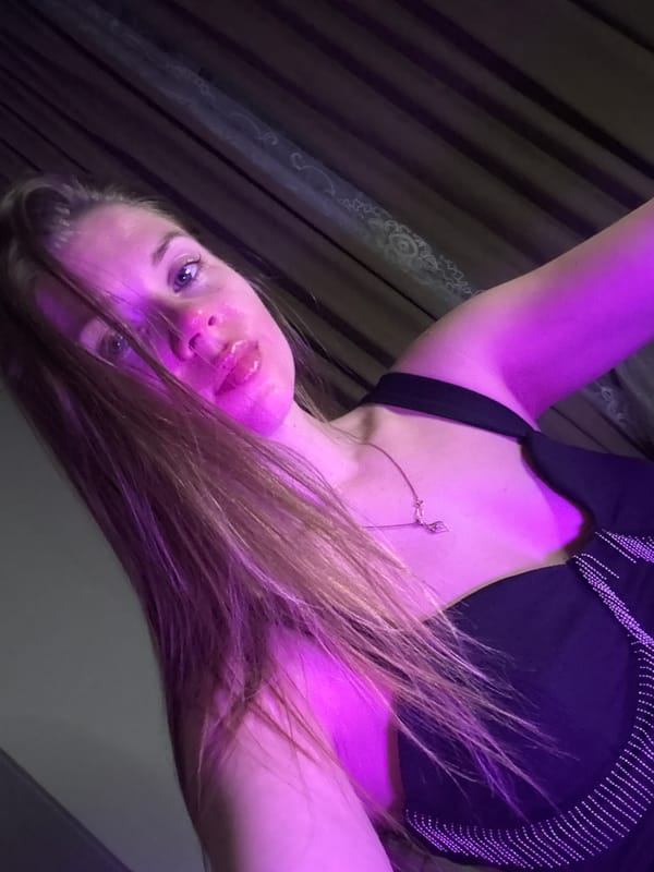 Woman photographed under purple lighting in Batumi, Georgia