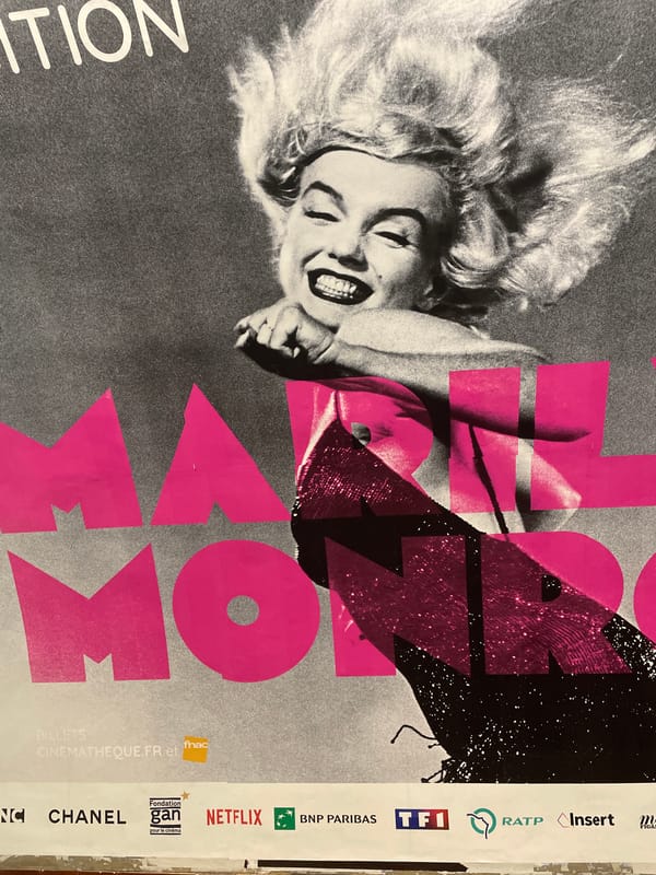 Urban scenes captured: Marilyn Monroe poster, subway train at station