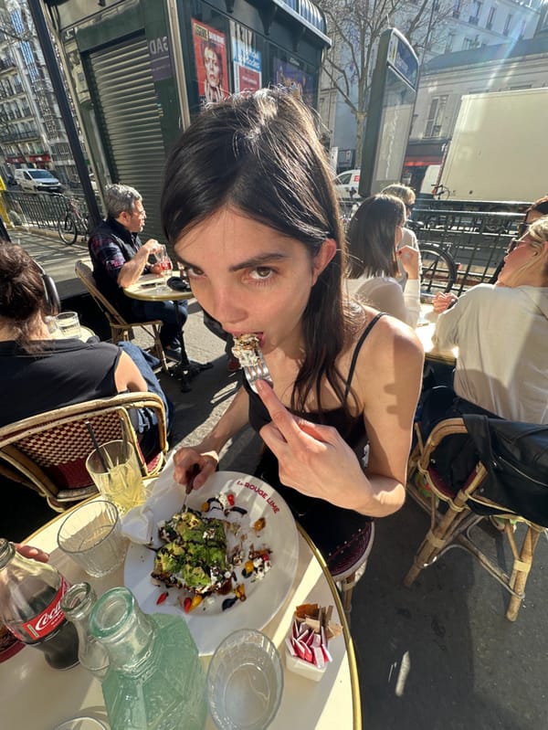 Couple enjoys afternoon at Parisian street cafe