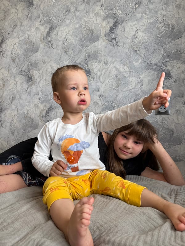 Children playing indoors in Rusanovo home Friday morning