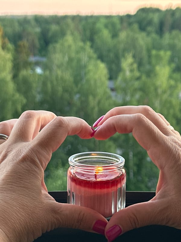 Evening balcony dinner with rosé, candles, and a gourmet spread