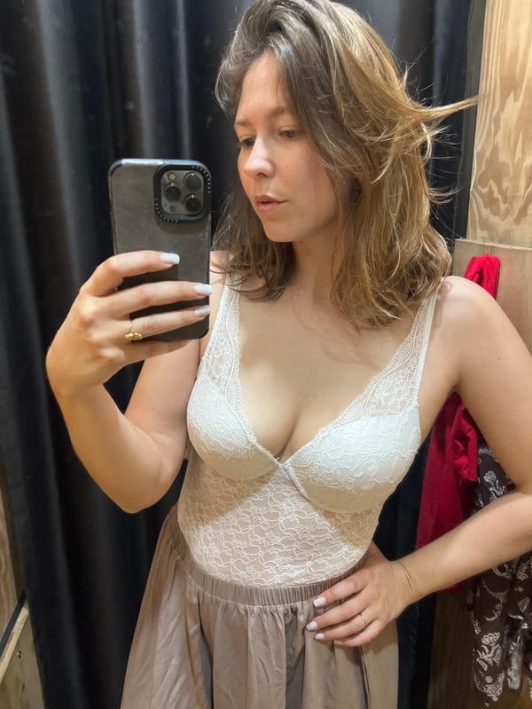 Woman takes fitting room selfies while shopping in Podgorica