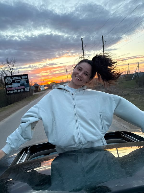 Woman enjoys car ride with wind in Dubnik