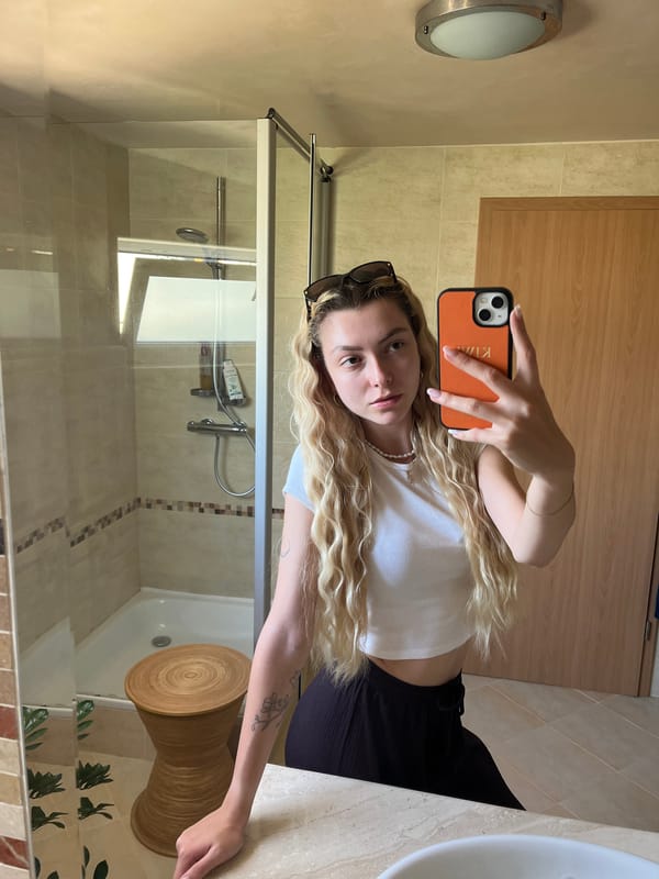 Woman Takes Multiple Bathroom Mirror Selfies in Seven Minutes