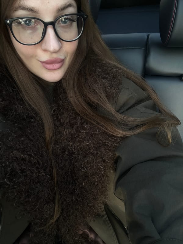 Woman documents dining experience at Chaikovsky restaurant with selfies