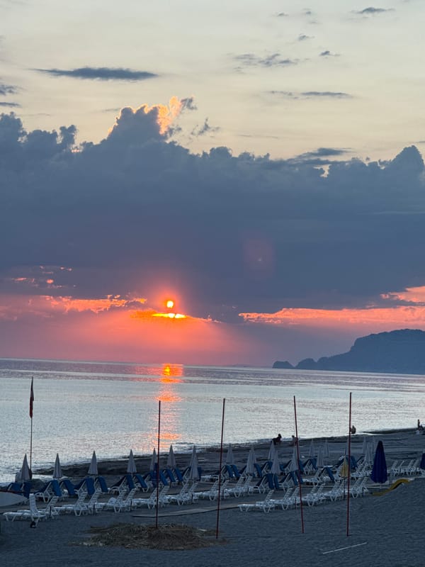 Sunset captured by multiple witnesses at waterfront beach
