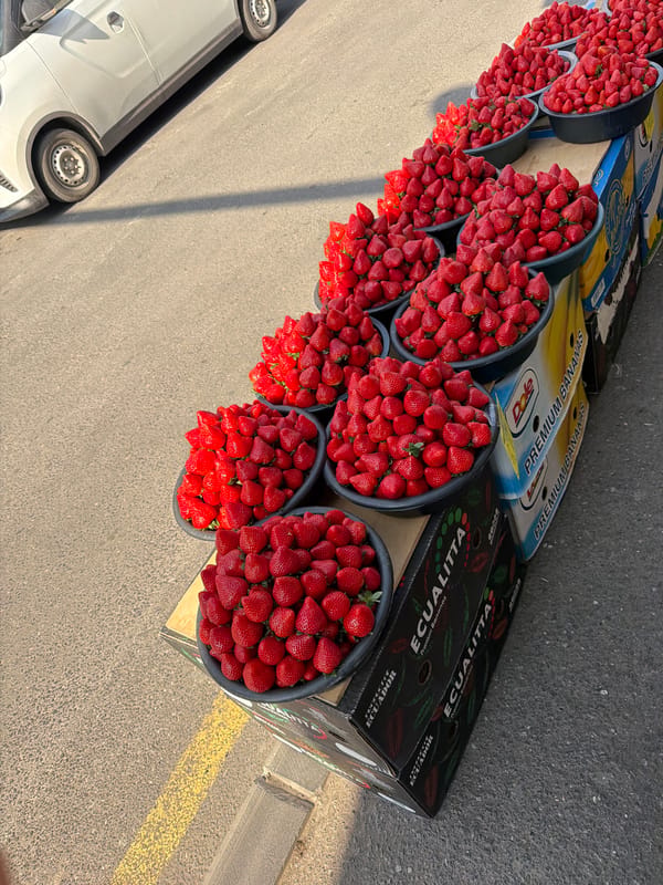 Fresh strawberries displayed at roadside market stall in Yerevan