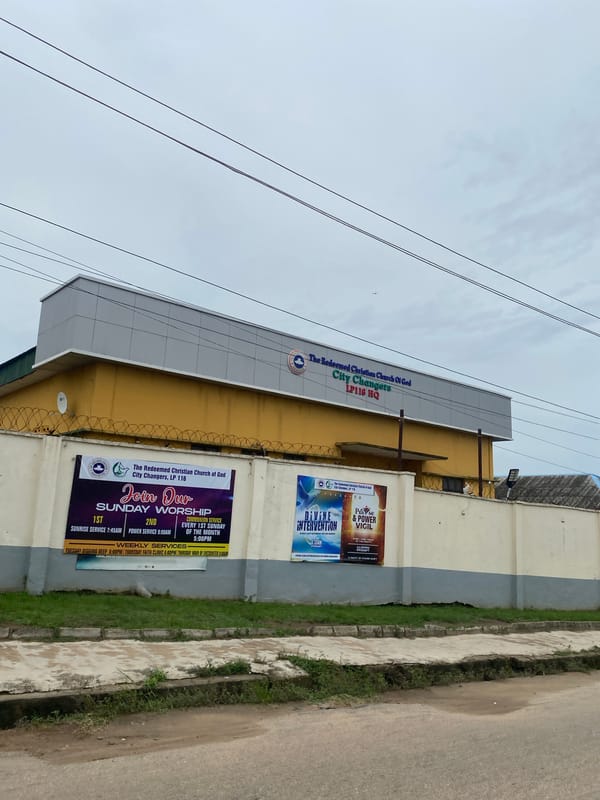 Lagos street scenes show church, mixed buildings on worn road