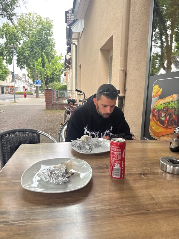 Man sits at table in Hattersheim during overcast day