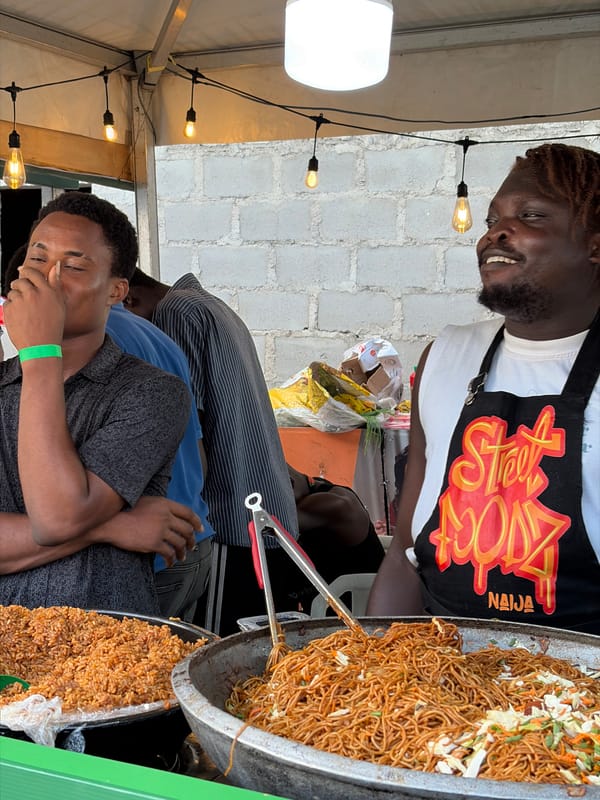 Street food vendor serves customers in Lagos