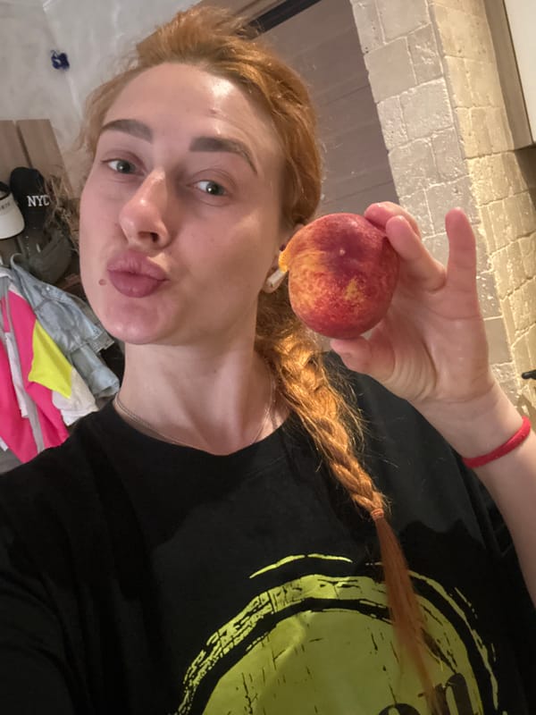 Woman eating peach captured in Budva residence
