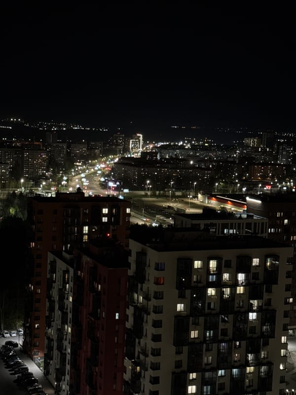 Nighttime aerial view captures illuminated Izhevsk cityscape