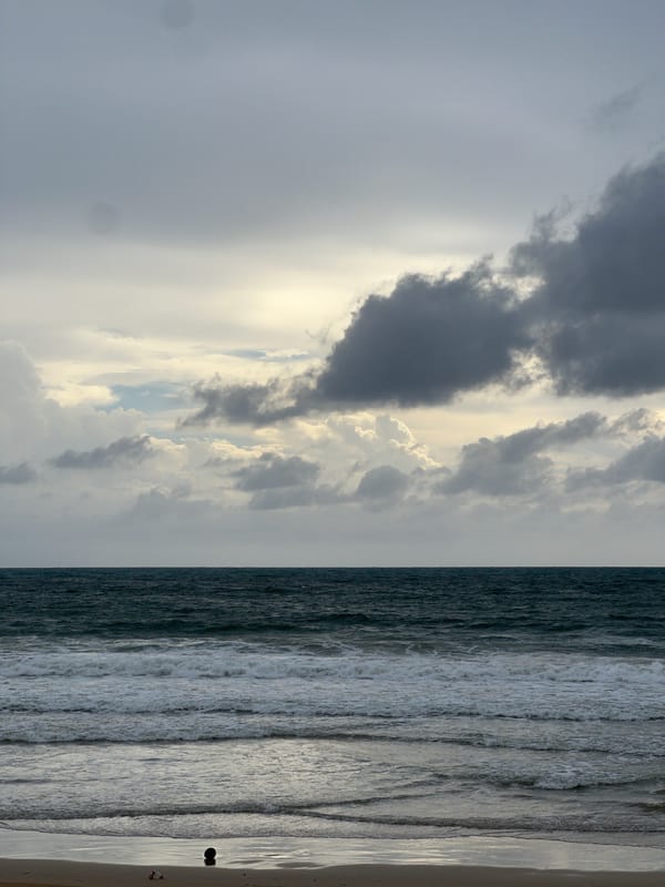 Beach warning conditions documented under stormy skies