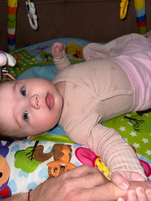 Baby playtime on colorful mat in Pleven