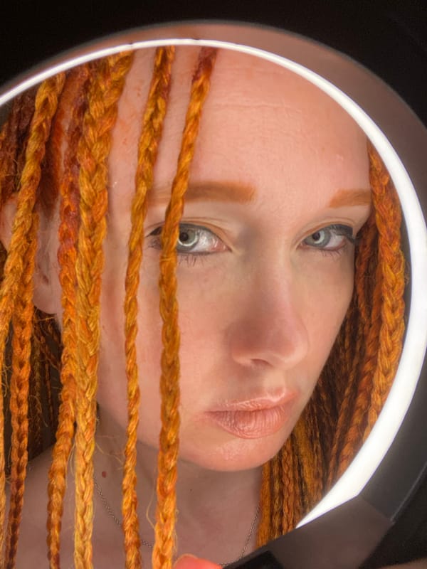 Woman conducts indoor portrait session with lighting equipment in Sochi