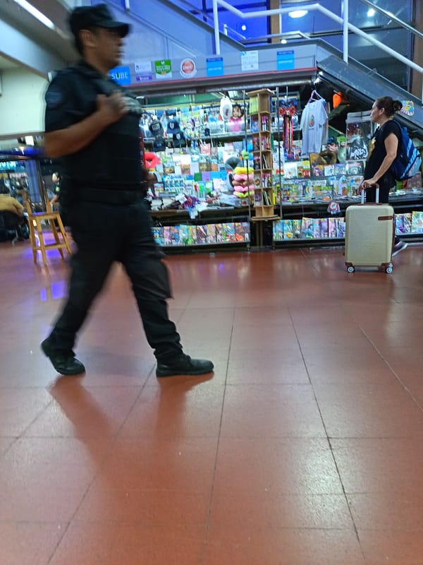 Security guard walks through Retiro train station in Buenos Aires