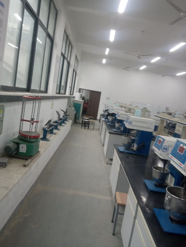 Lab workers test soil samples in Jiangjin facility