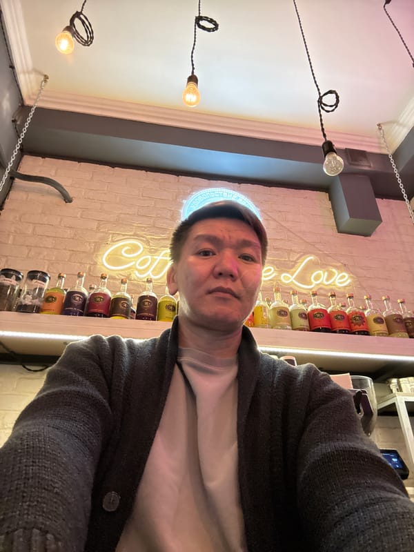 Person takes selfie at coffee shop in Khimki, Russia
