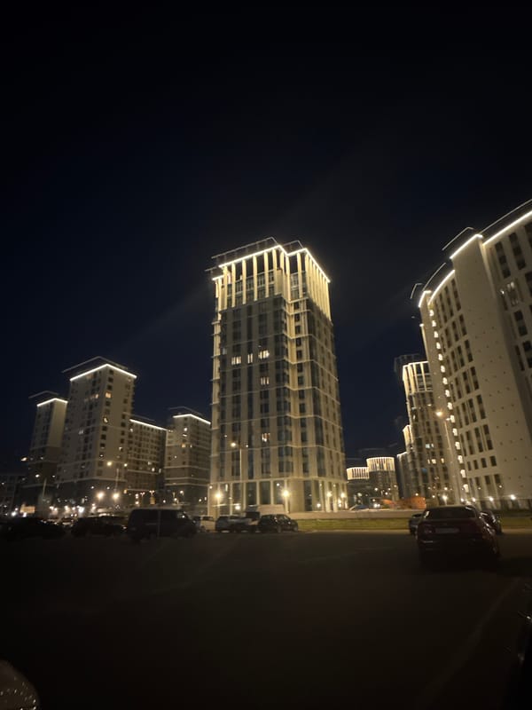 Night scenes around a modern Saint Petersburg residential district, including a crash