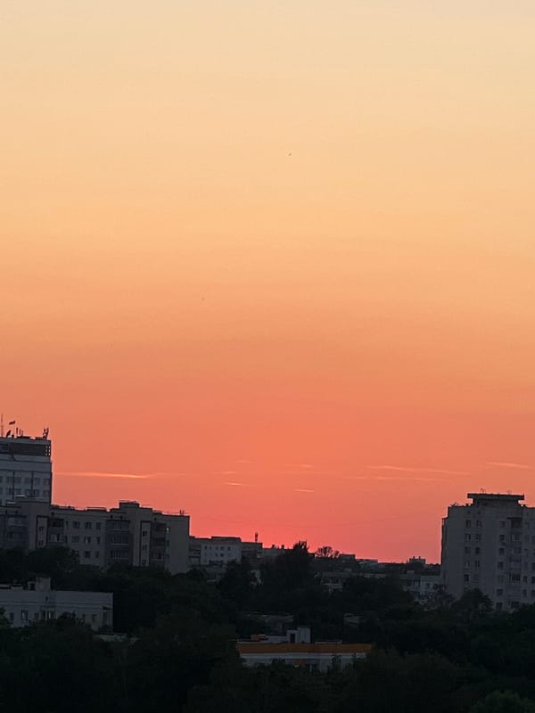 Minsk skyline at dusk, city and forest in frame