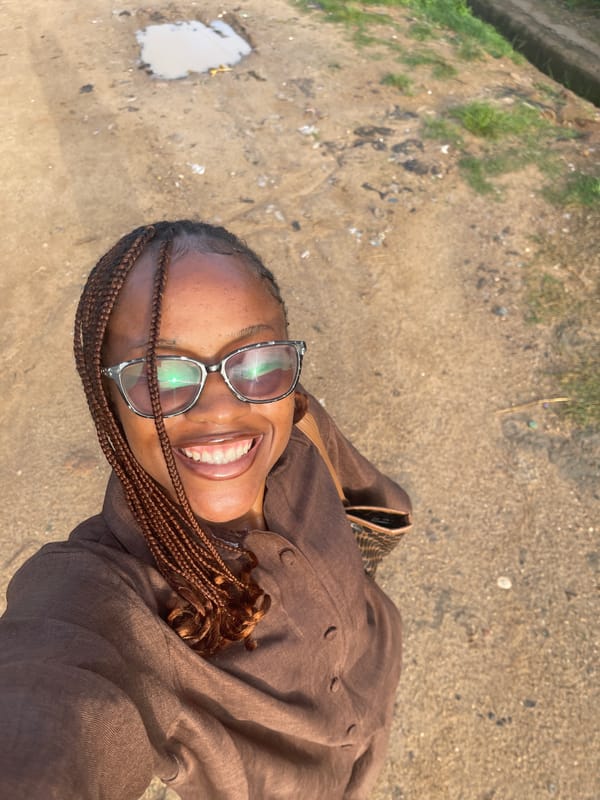 Morning street life on a dirt road in Rafin Par, Nigeria
