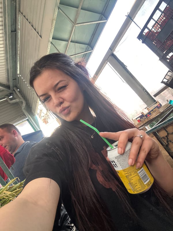 Young woman documents morning market visit in Sliven, Bulgaria