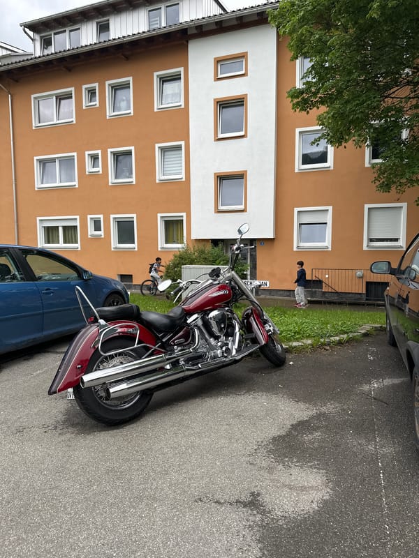 Young man performs split jump on Garmisch-Partenkirchen street
