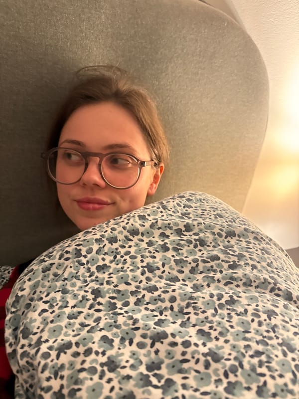 Woman rests on couch in Perugia home