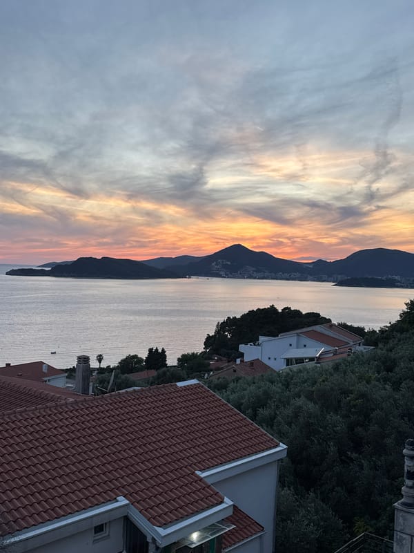 Sunset observed over mountains in Sveti Stefan, Montenegro