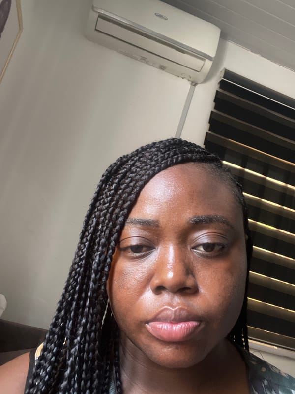 Woman photographed in portrait session in Abuja residence